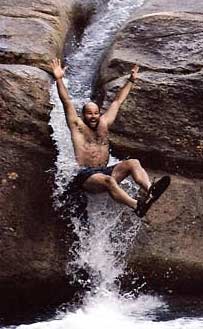 A swimmer enjoys the falls in one of the White Mountains’ wonderful rivers